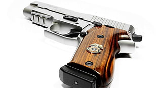 closeup photography of Desert Eagle pistol on white surface HD wallpaper